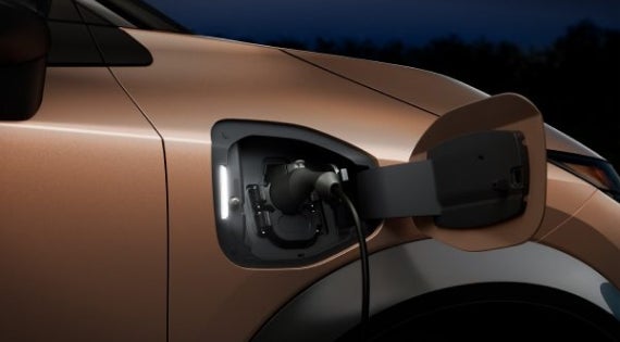 Close-up image of charging cable plugged in | Andy Mohr Avon Nissan in Avon IN